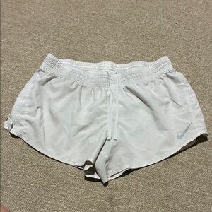 Nike Women's White Athletic Running Shorts with Light Blue Swoosh